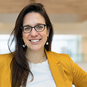 A headshot-style photo of Isabelle Côté. She is photographed from the mid-chest up and looking at the camera.